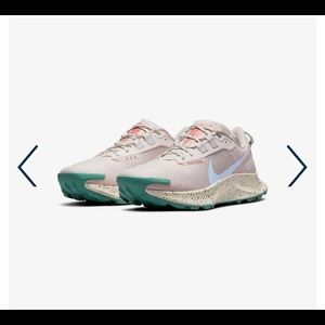 Pink Nike Pegasus trail shoes